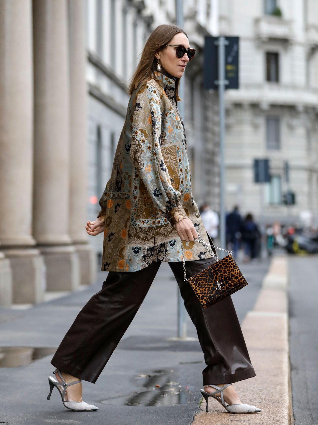 Annette Weber teams a floral tunic with a leopard print clutch 