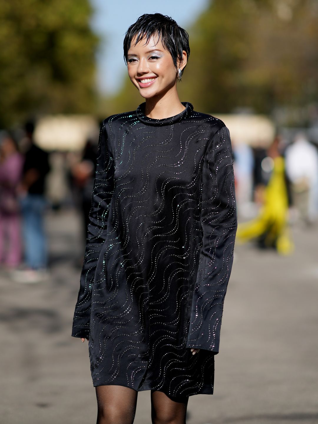 Khanh Linh shows off her 'whisper pixie' outside the Stella McCartney show during PFW
