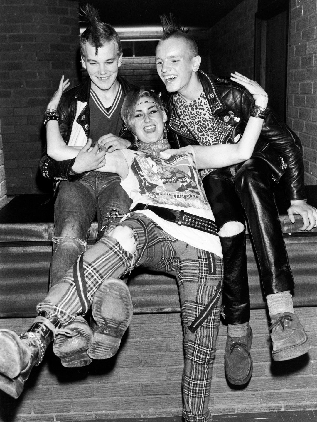 Punks in the 1980s sporting Mohicans and Doc Martens boots.