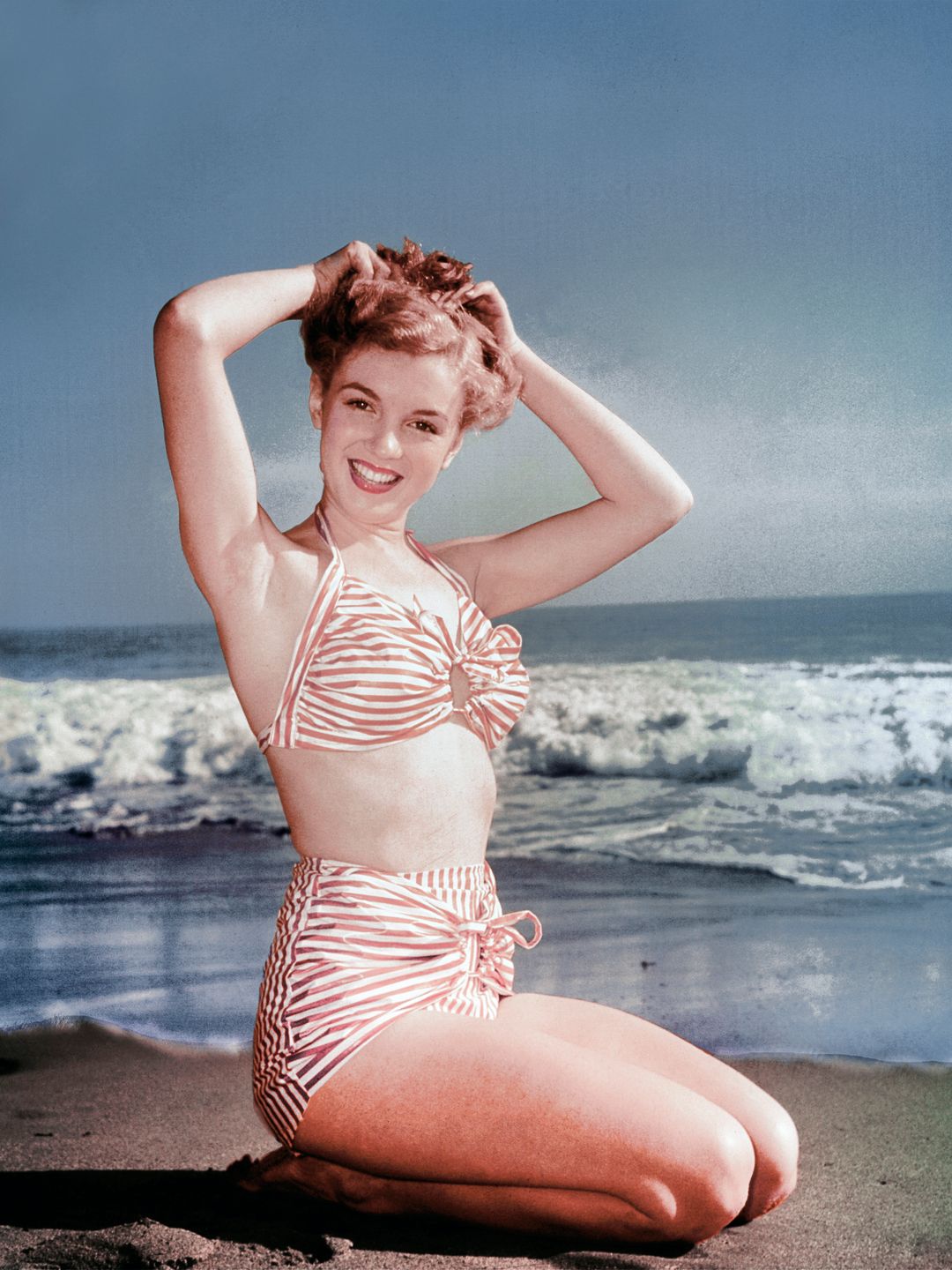 Marilyn Monroe wearing a high-waisted bikini  