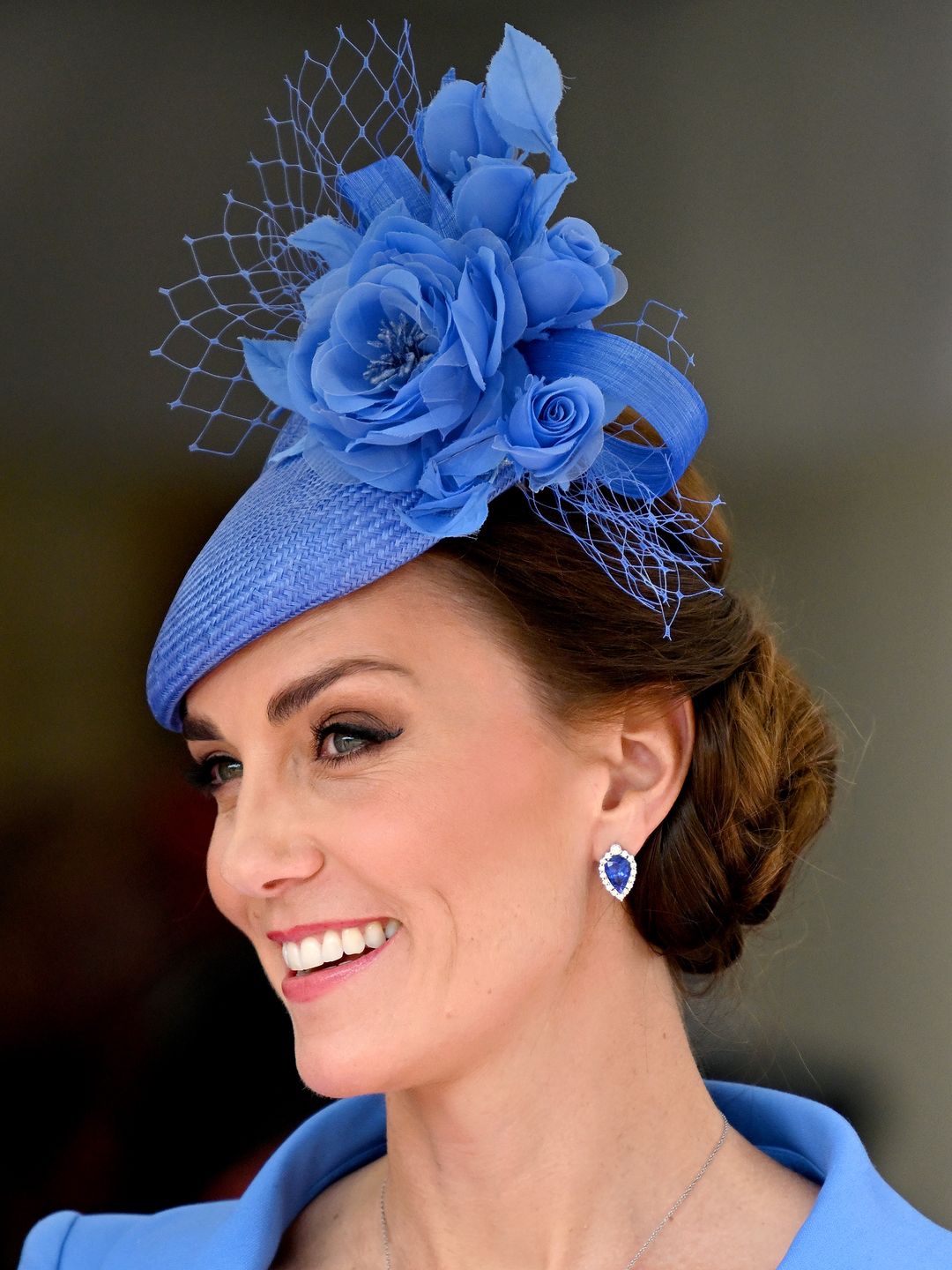 The Princess of Wales with her hair in a blue floral fascinator 