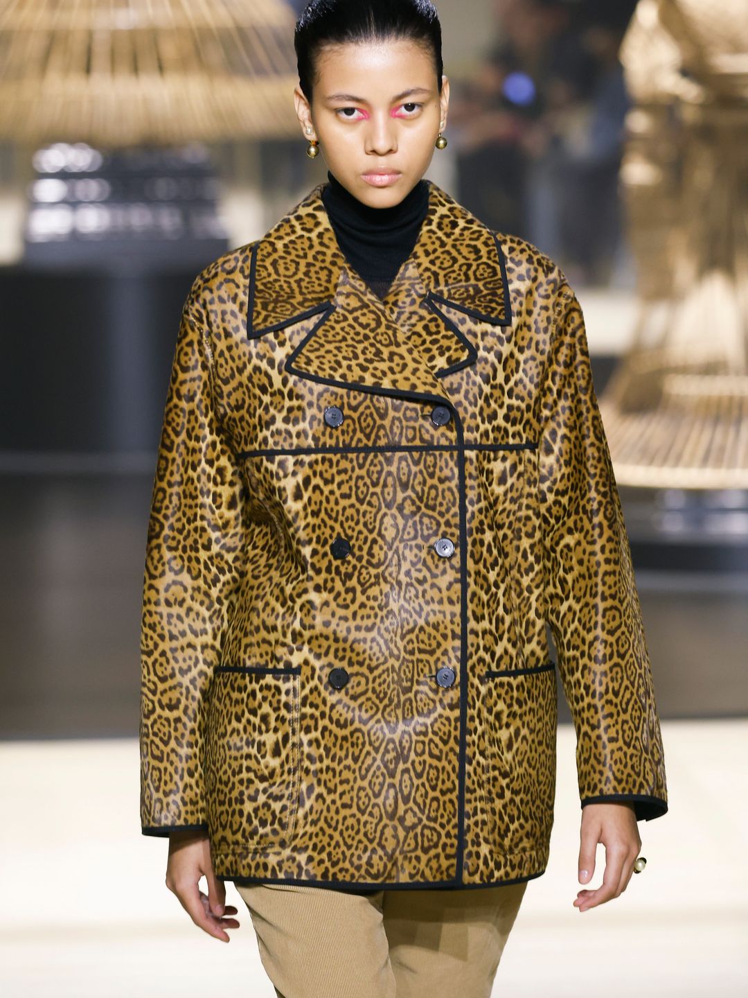 A model walks the runway during the Dior Ready to Wear Fall/Winter 2024-2025 fashion show in a leopard print coat
