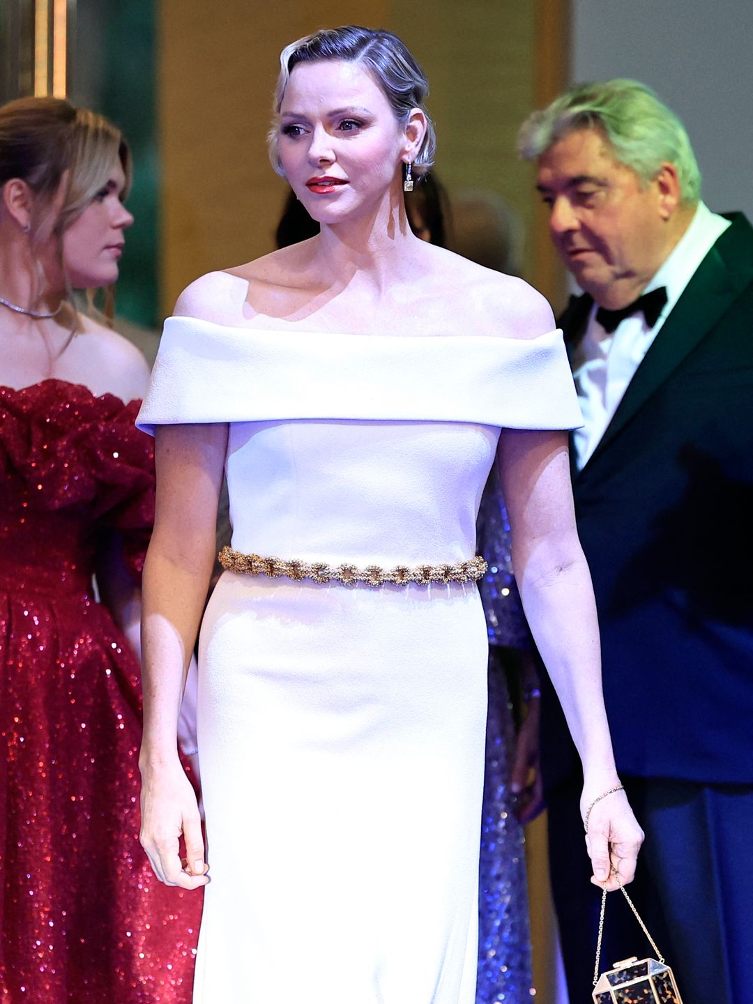 Full body picture of Princess Charlene in a white dress