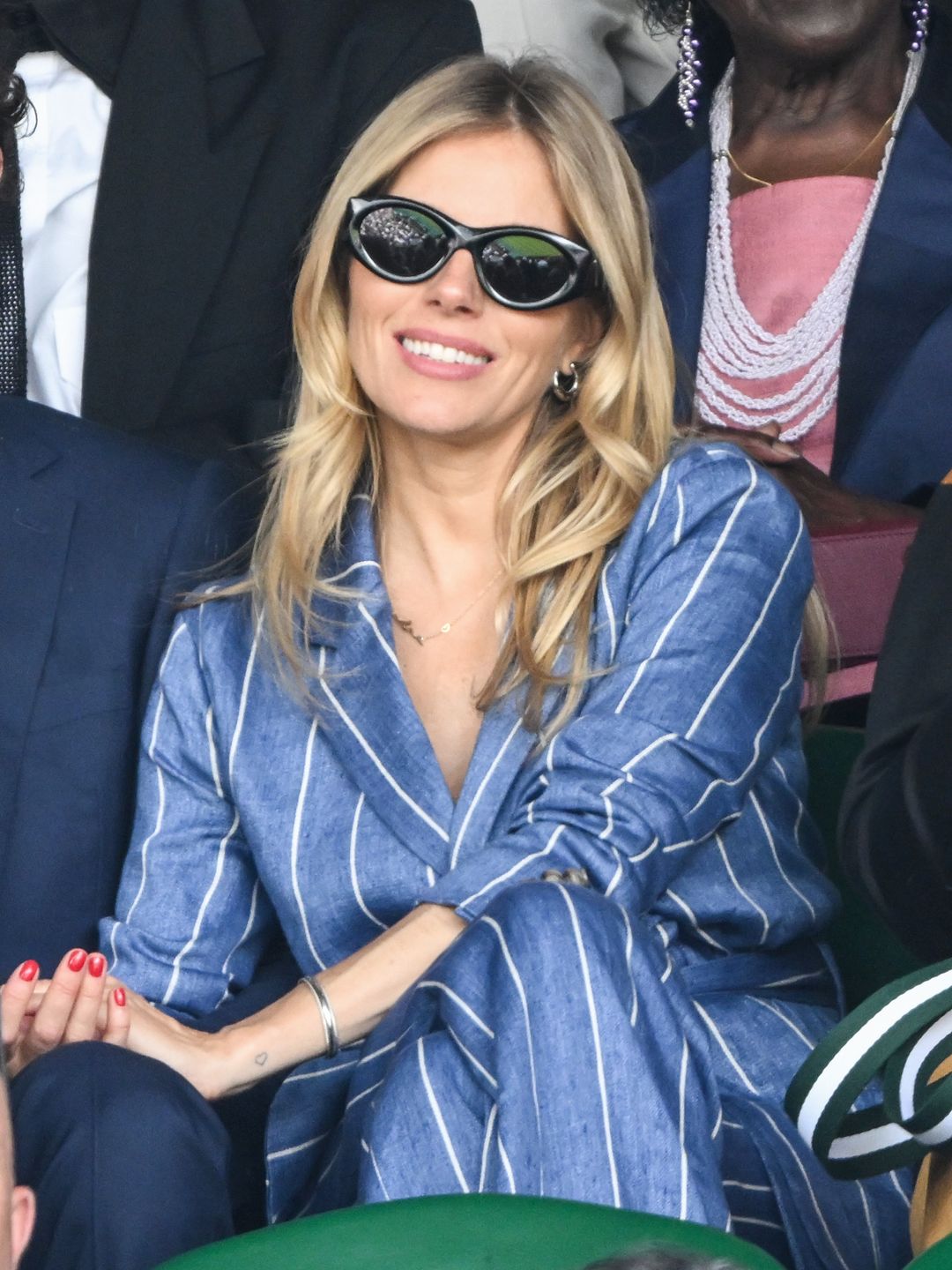Sienna Miller attended day seven of the Wimbledon Tennis Championships in July wearing the earrings