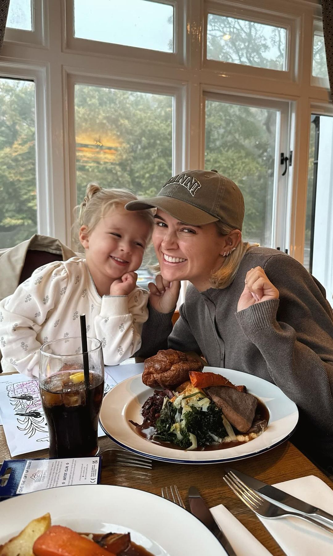 Molly-Mae Hague and her daughter Bambi pose for a picture while eating a Sunday roast