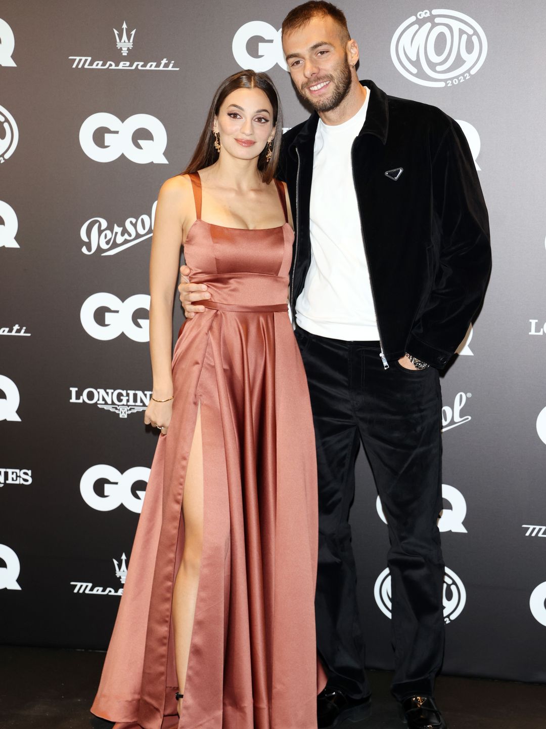 Rossella Fiamingo in a pink satin dress and Gregorio Paltrinieri in a black jacket