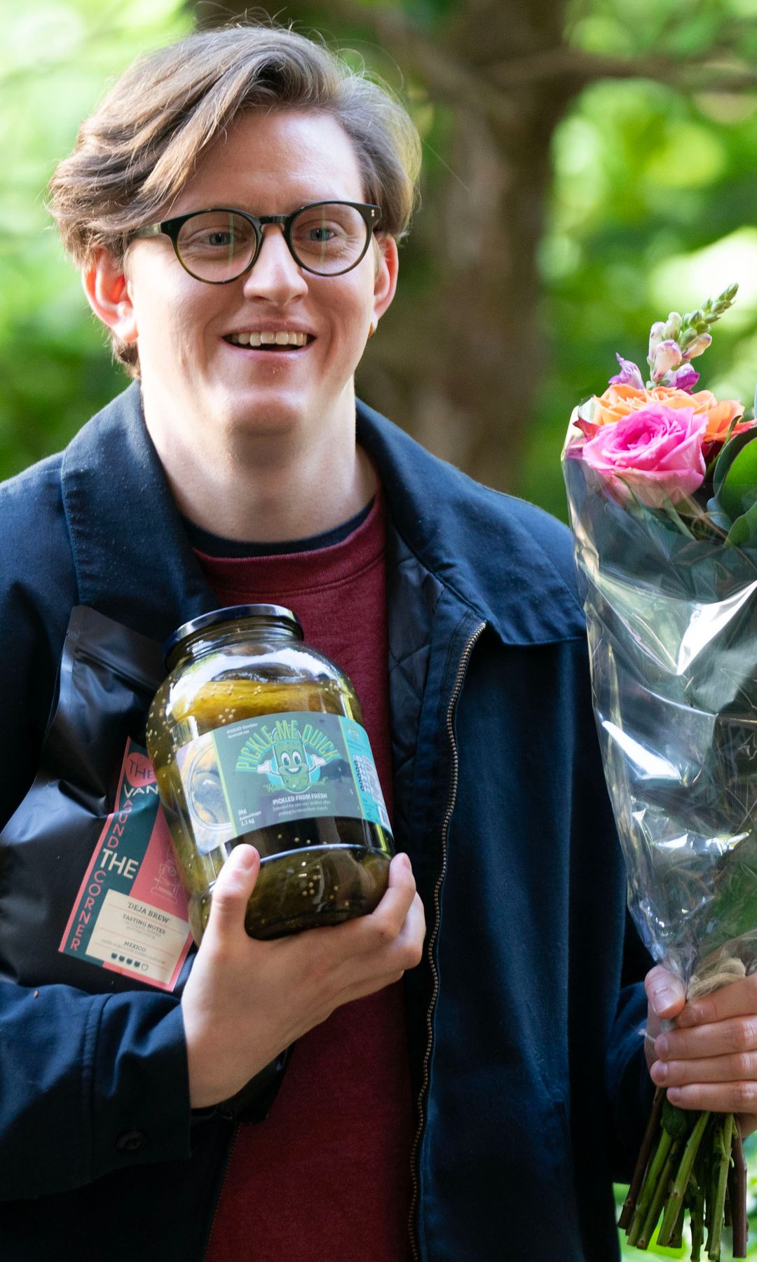Lorn Macdonald holding flowers and pickles in a still from Dinosaur