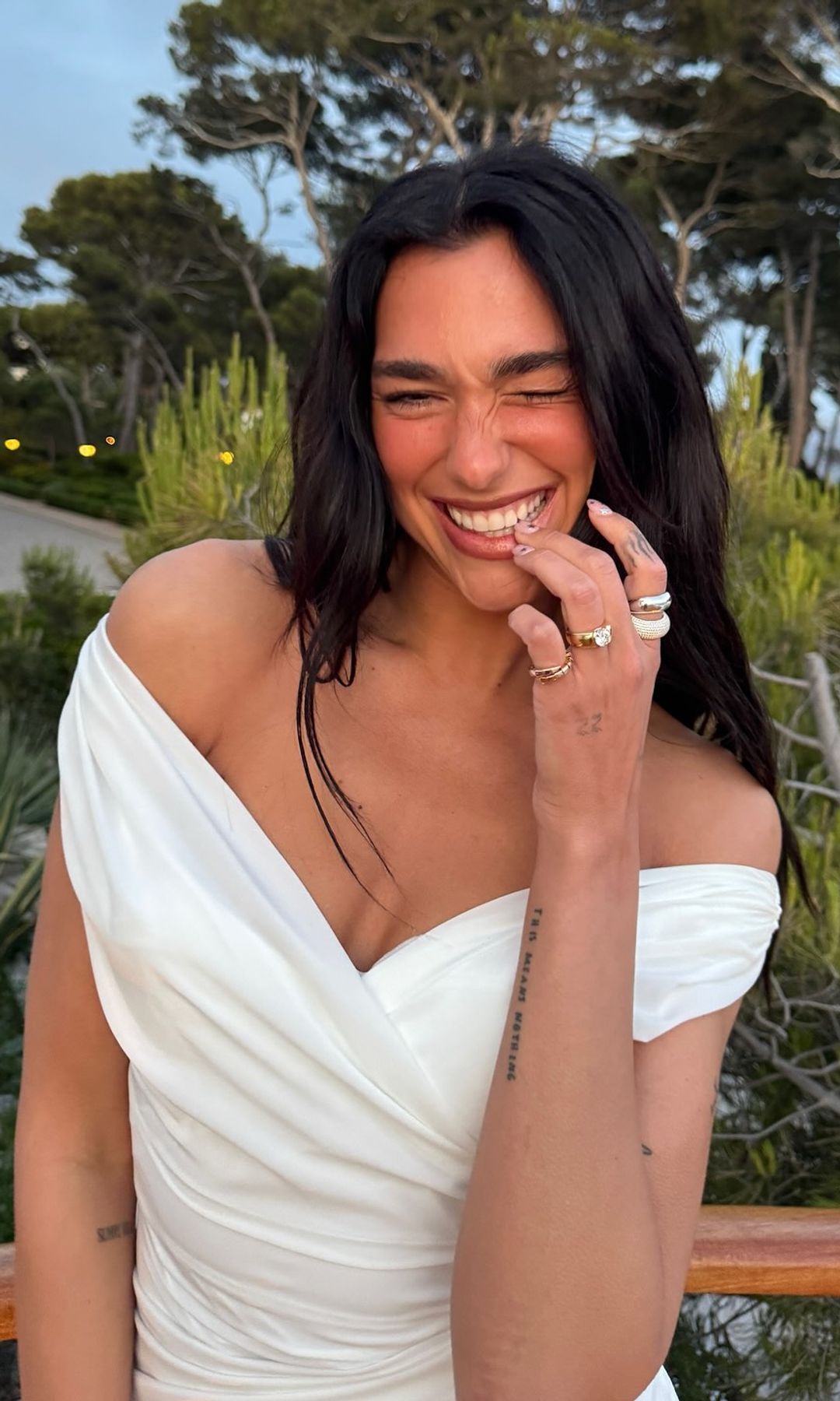 Dua Lipa poses in a white gown on her Instagram