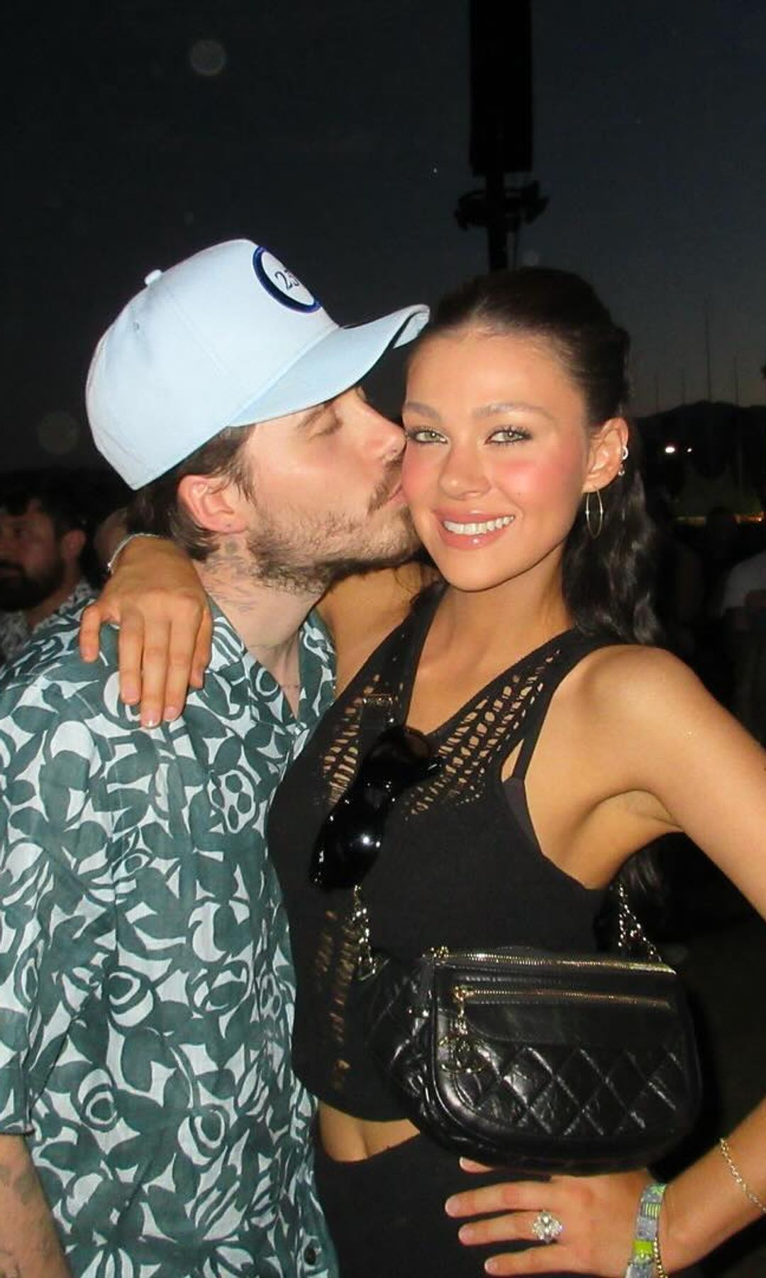 Nicola and Brooklyn Peltz Beckham share a kiss at Coachella