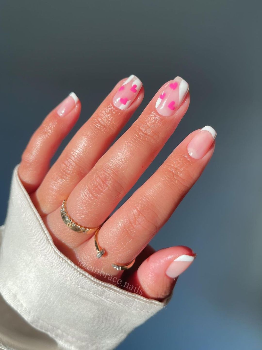 Nails with pink hearts and white tips 