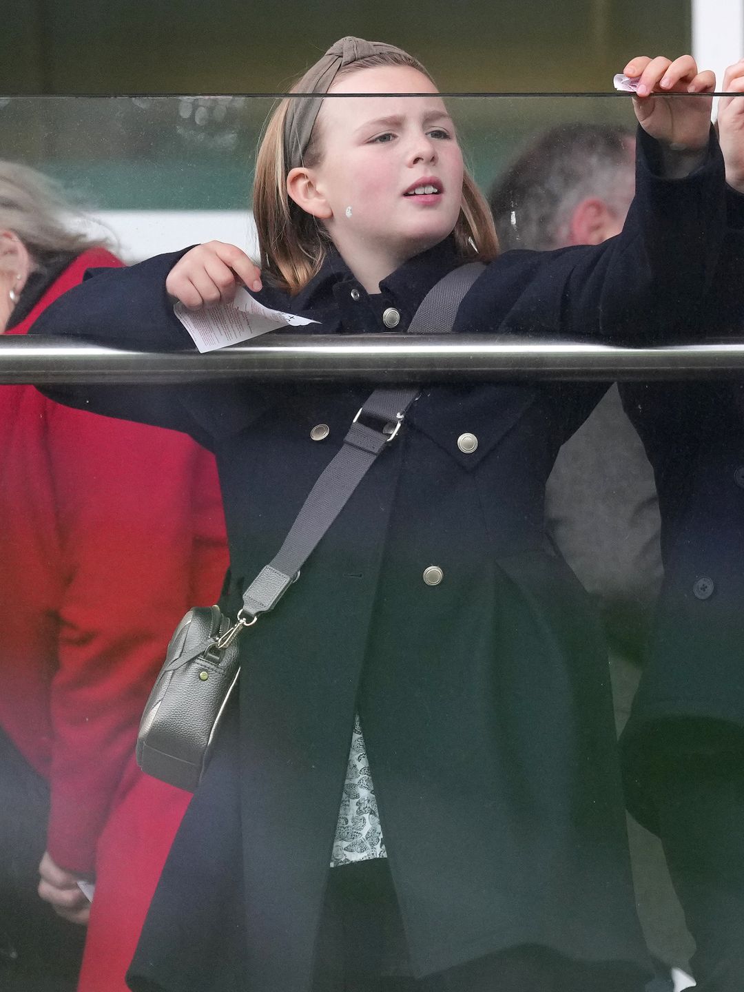 Mia Tindall tears up her betting slip and throws it over the balcony at the New Years Day Meeting at Cheltenham Racecourse, Cheltenham, Gloucestershire, UK, on the 1st January 2024
