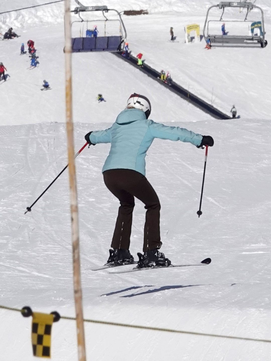 Lady Louise Windsor jumping in a pair of skis