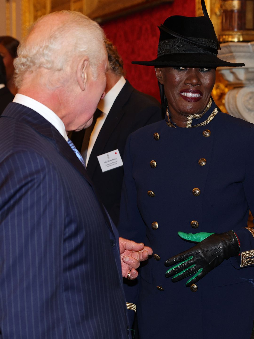 King Charles talking to Grace Jones