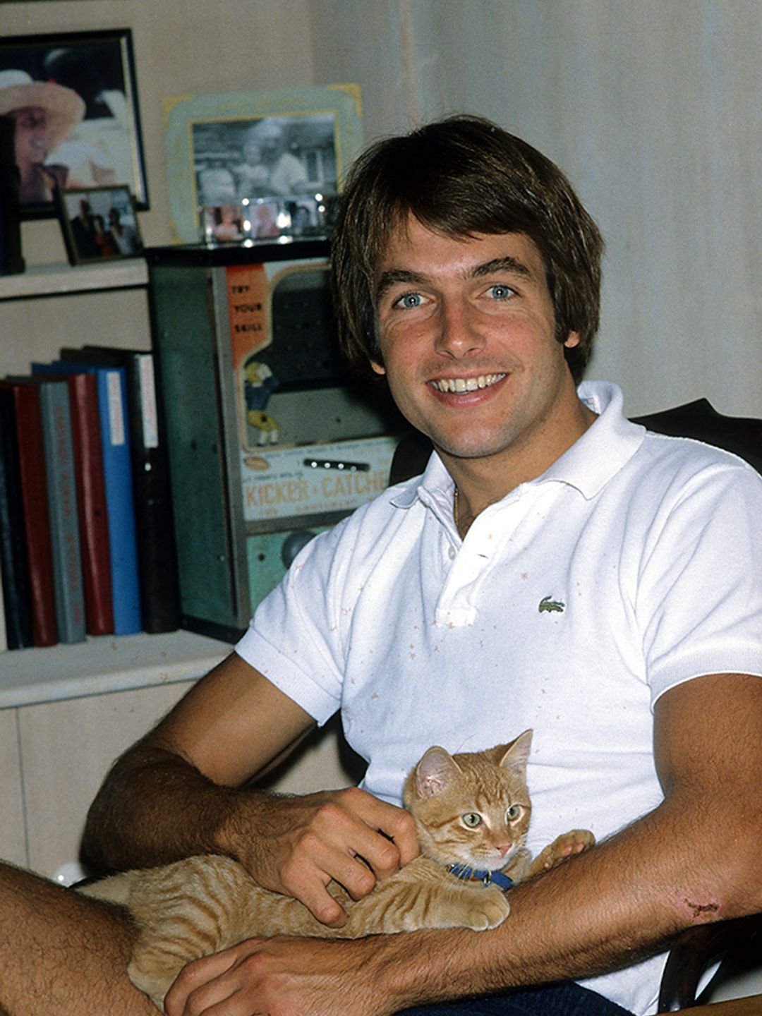 Mark Harmon sat in his room with a cat 