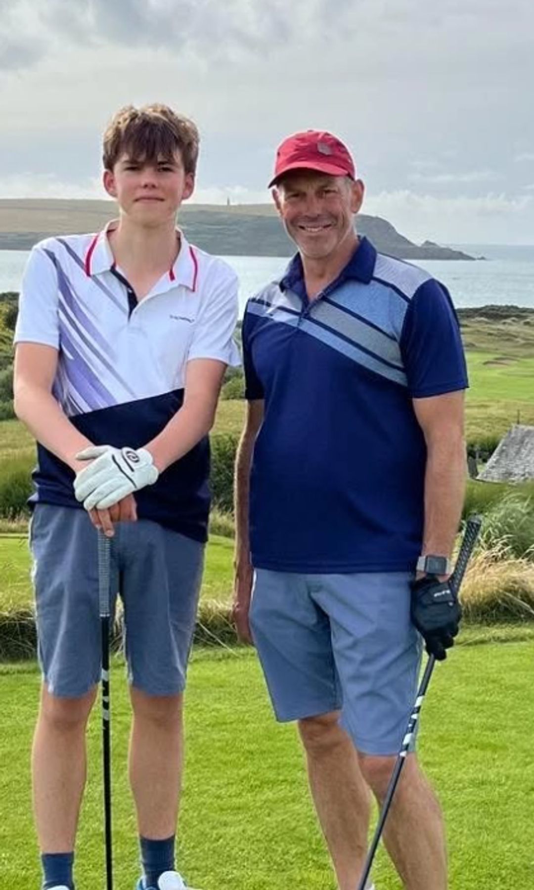 Phil Spencer and his son on a golf course