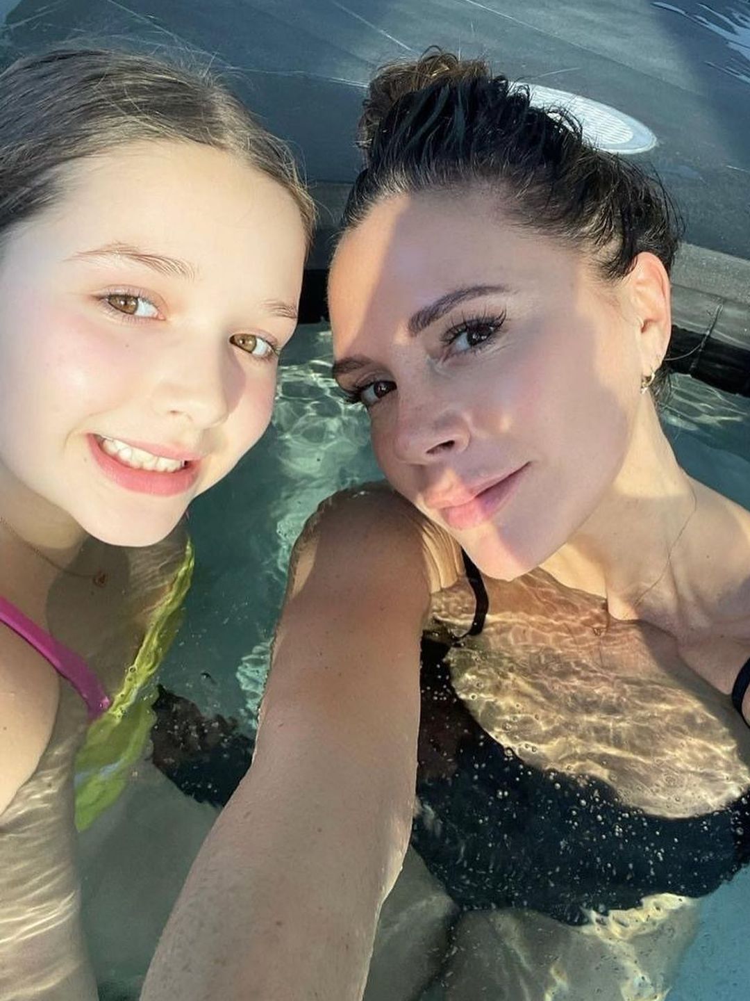 mother and daughter in pool