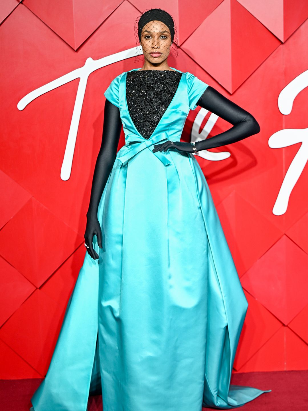 Ikram Abdi in blue dress