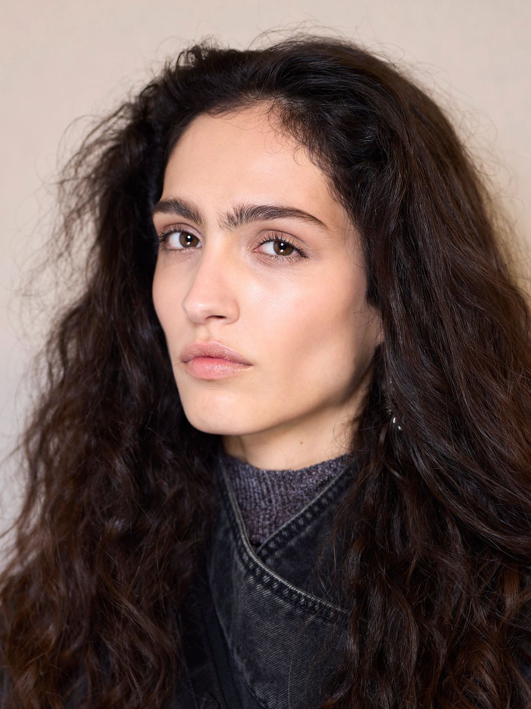 A model poses backstage at the Isabel Marant F24 show