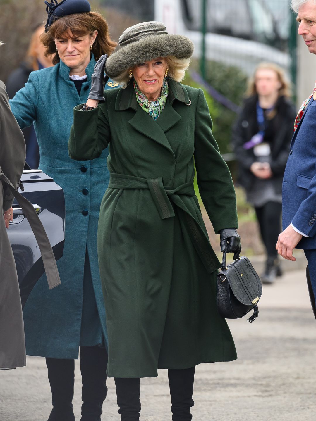 Queen Camilla wearing a green coat at Cheltenham races