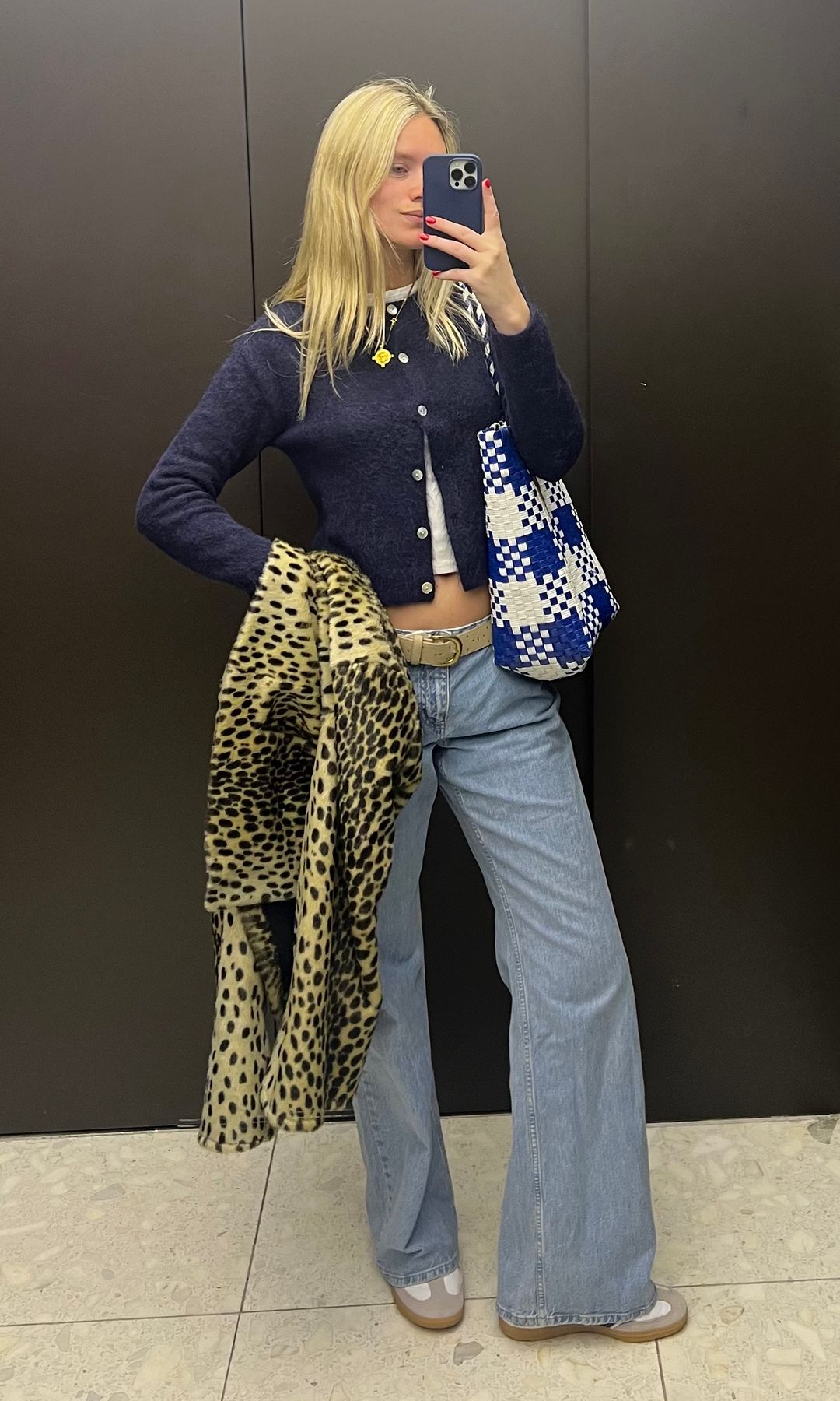 blonde girl life selfie in blue cardigan