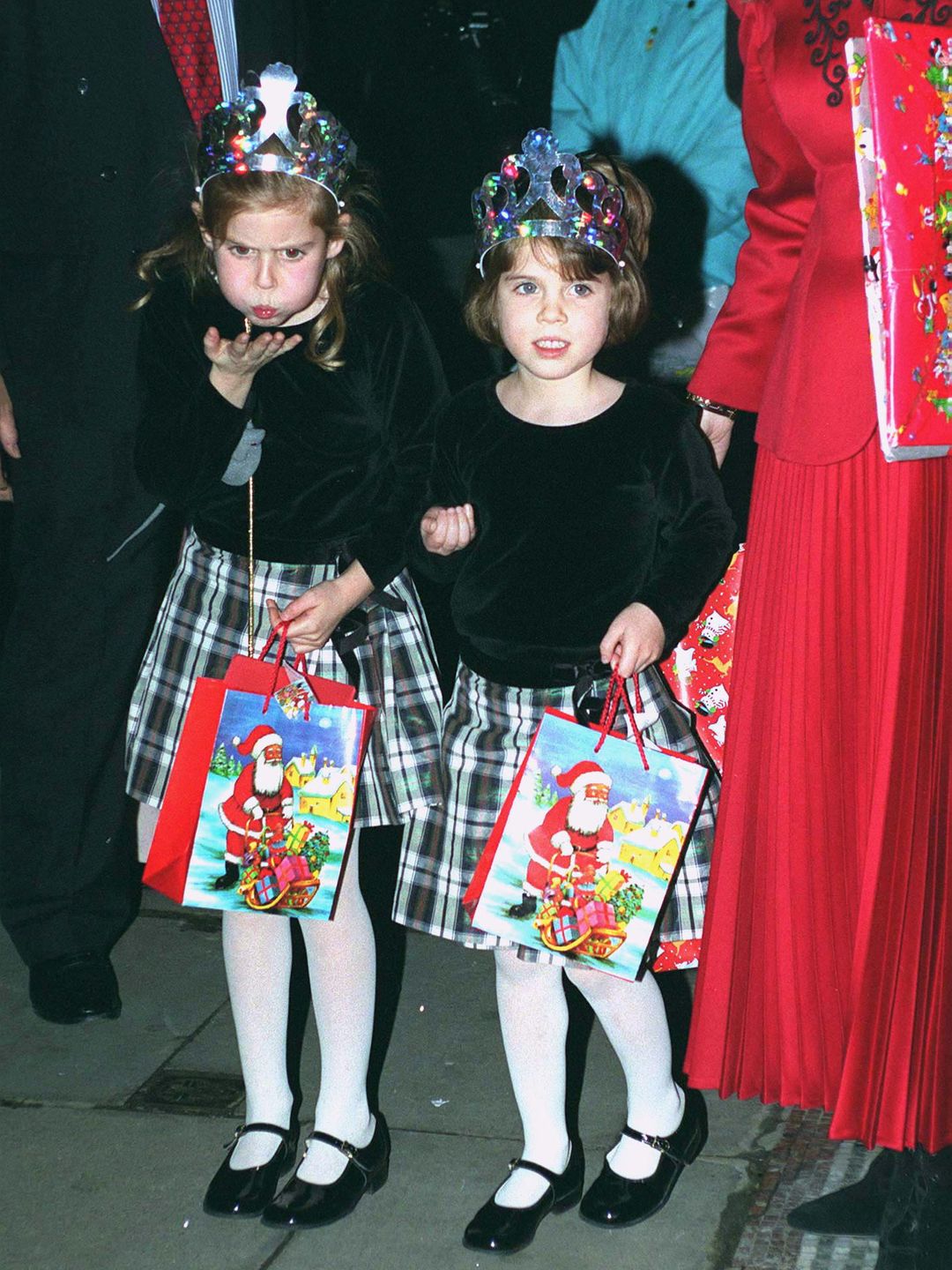 Princess Beatrice and Princess Eugenie holding Christmas gifts after panto