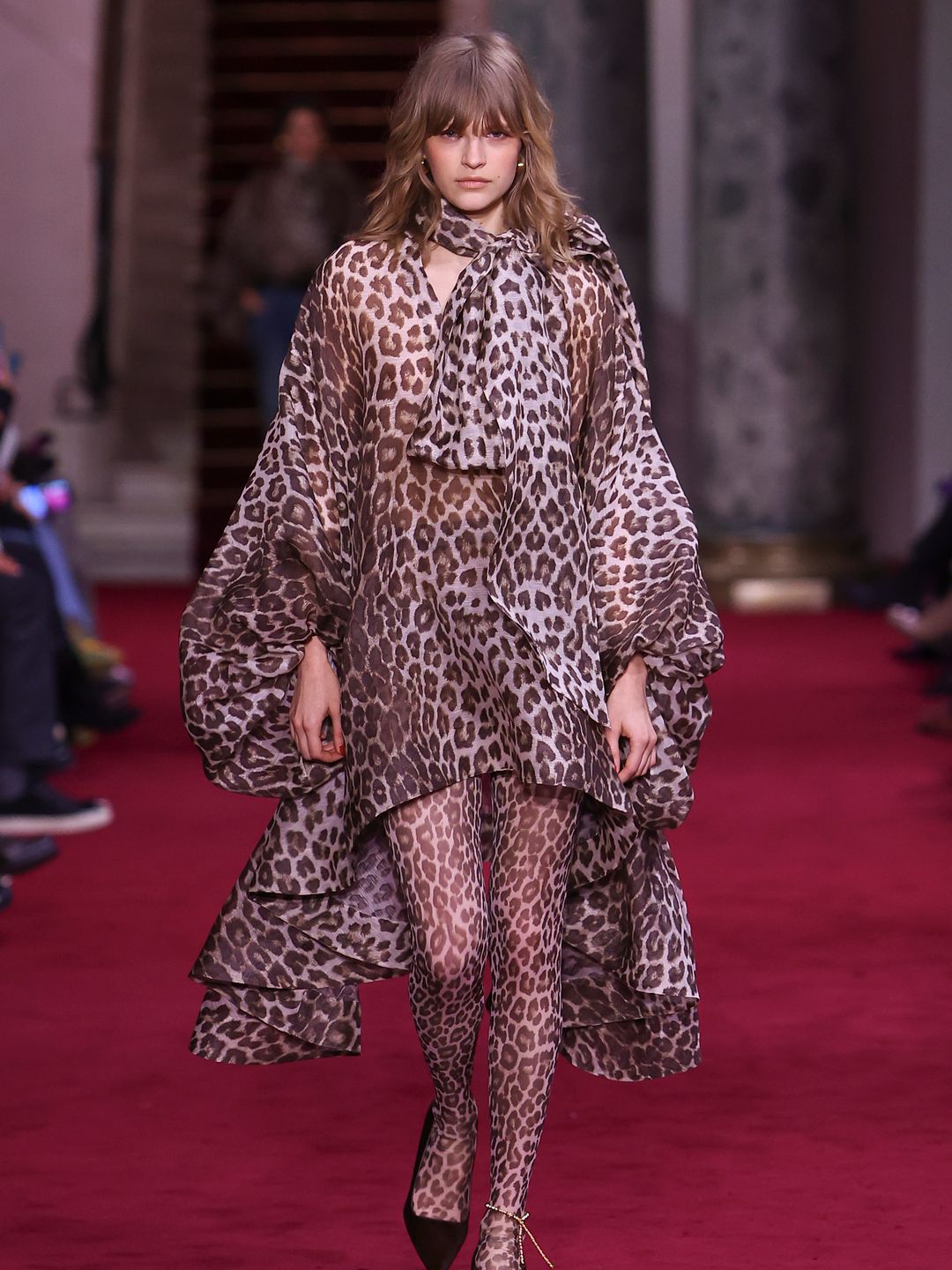 A model walks the runway during the Zimmermann Ready to Wear Fall/Winter 2024-2025 fashion show in a leopard print dress