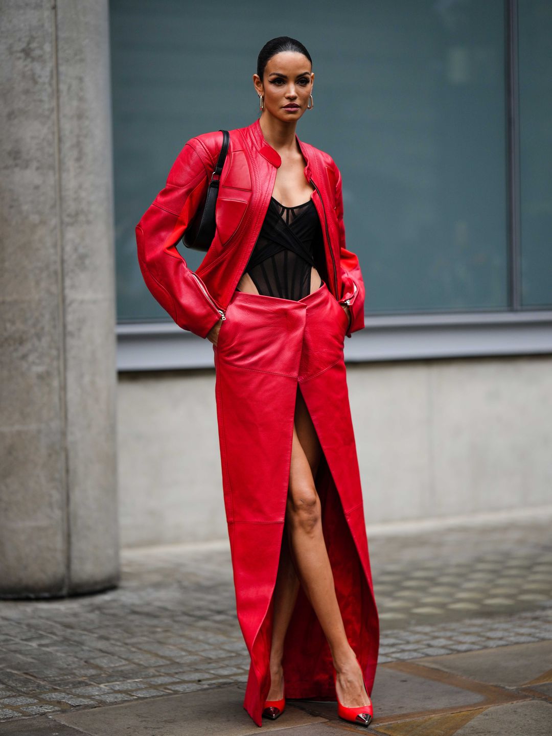 Woman wearing red leather skirt 