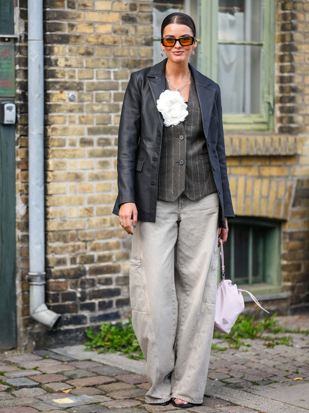 A Copenhagen Fashion Week teams a pinstripe waistcoat with a leather blazer