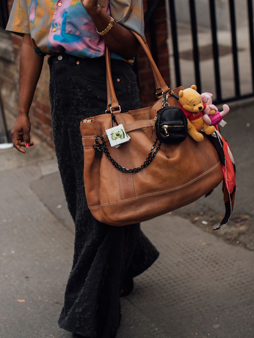 With a slouchy, caramel leather hobo bag