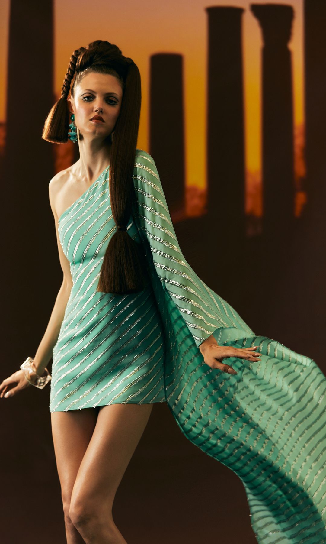 model in aqua glitter mini dress