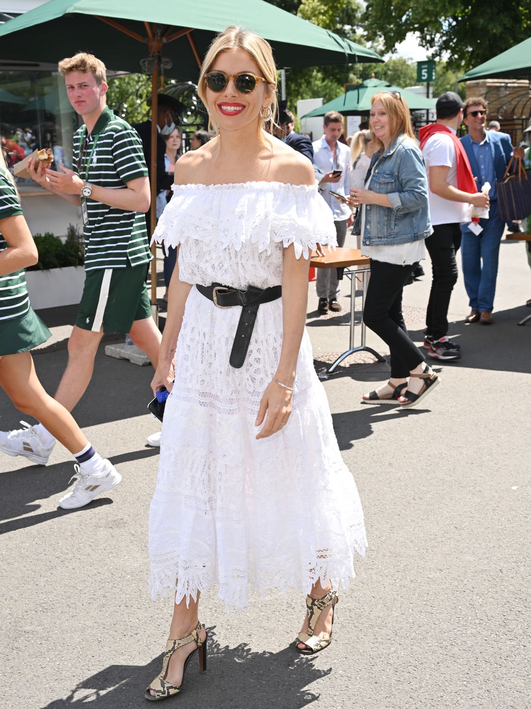 Sienna Miller in a white Bardot dress