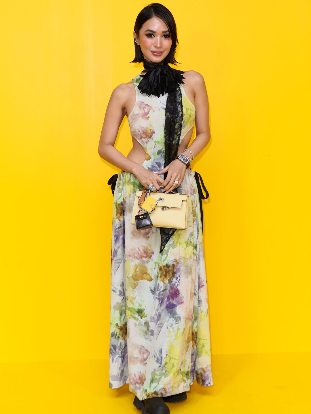 Heart Evangelista attended the  Onitsuka Tiger fashion show in a cutout floral dress with black combat boots and a frill lace collar. 