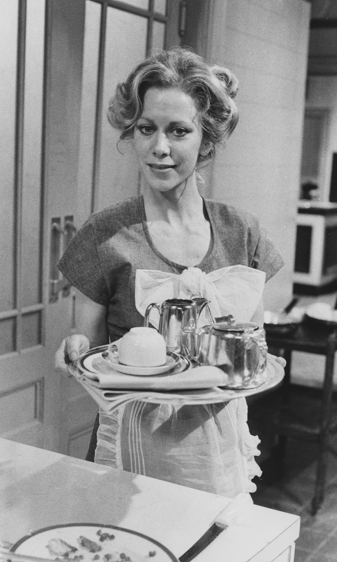 Still black-and-white image of Connie Booth in Fawlty Towers