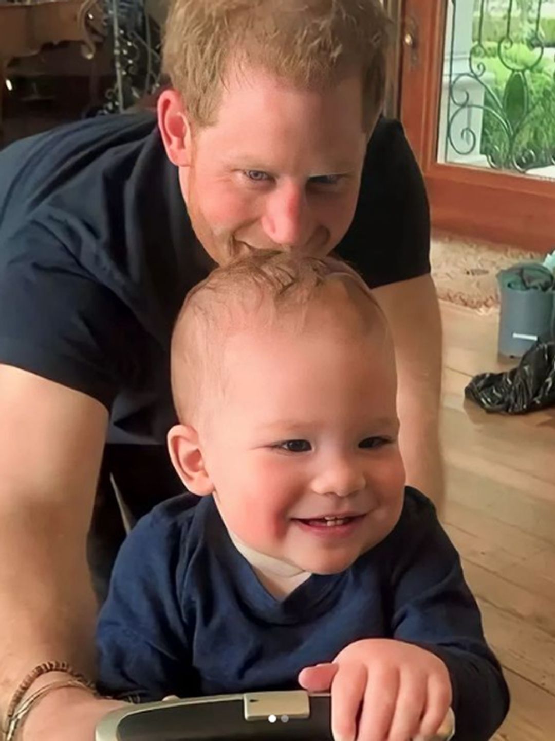 Prince Harry crawls on all fours with his son Archie in a sweet home video