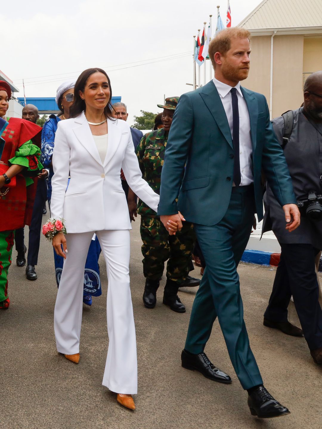 meghan and harry in suits nigeria 