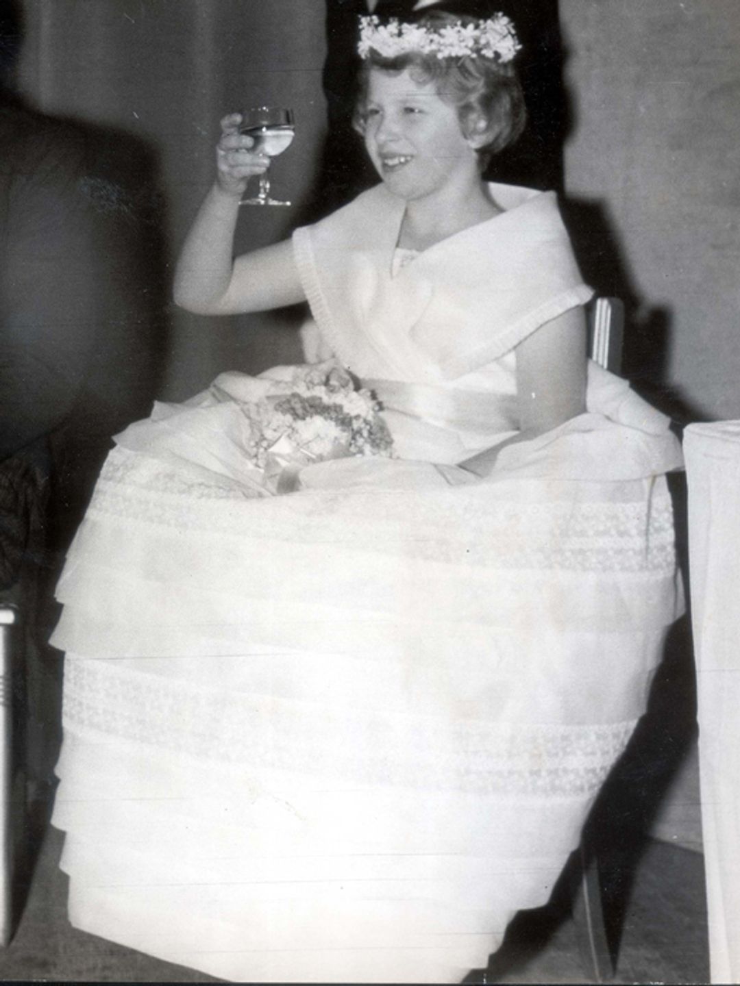 Princess Anne raising a glass at Lady Pamela's wedding
