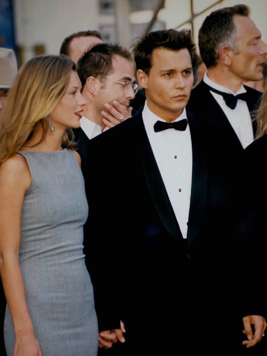 Kate Moss in a grey dress with then-boyfriend Johnny Depp