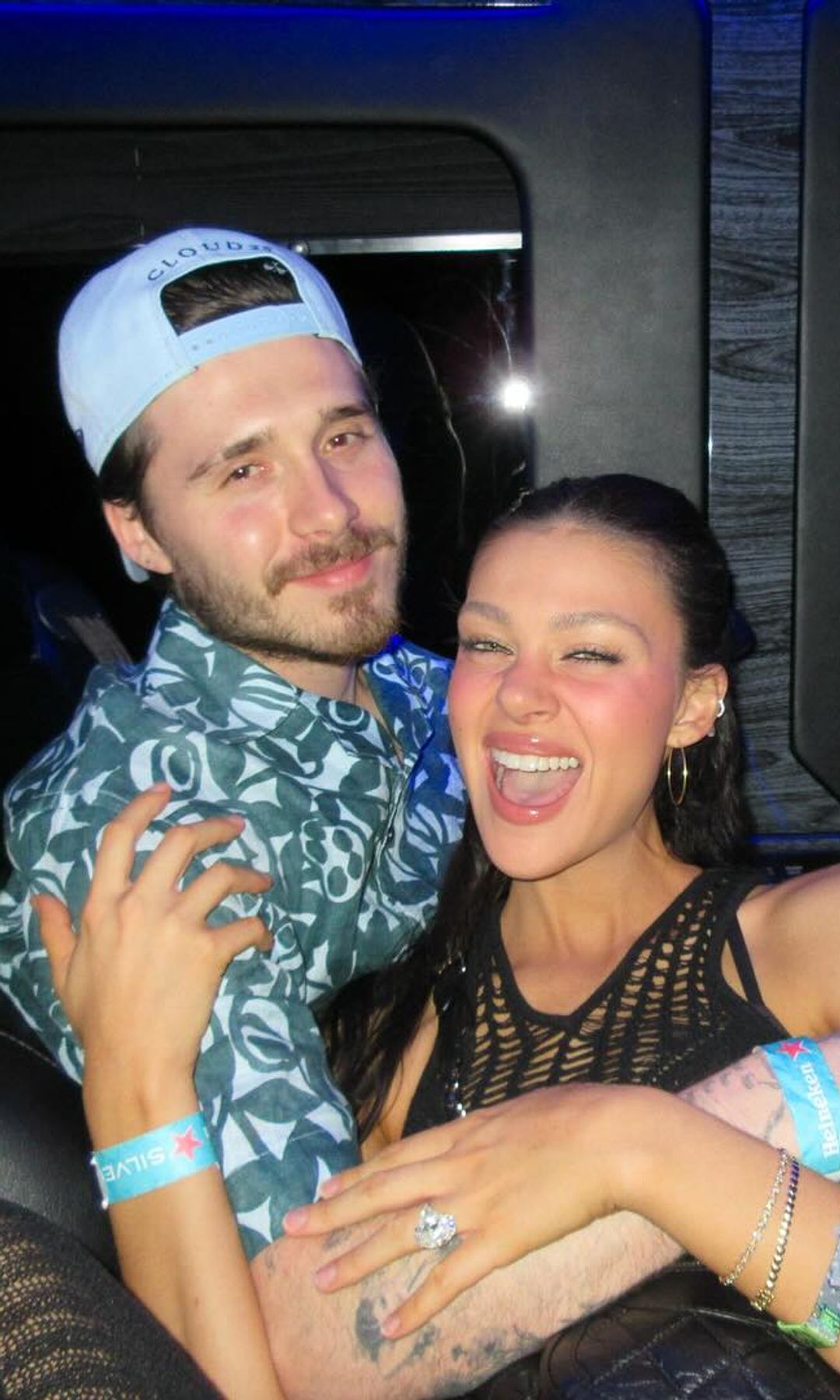 Nicola and Brookyln Peltz Beckham are seen hugging in the back of a car