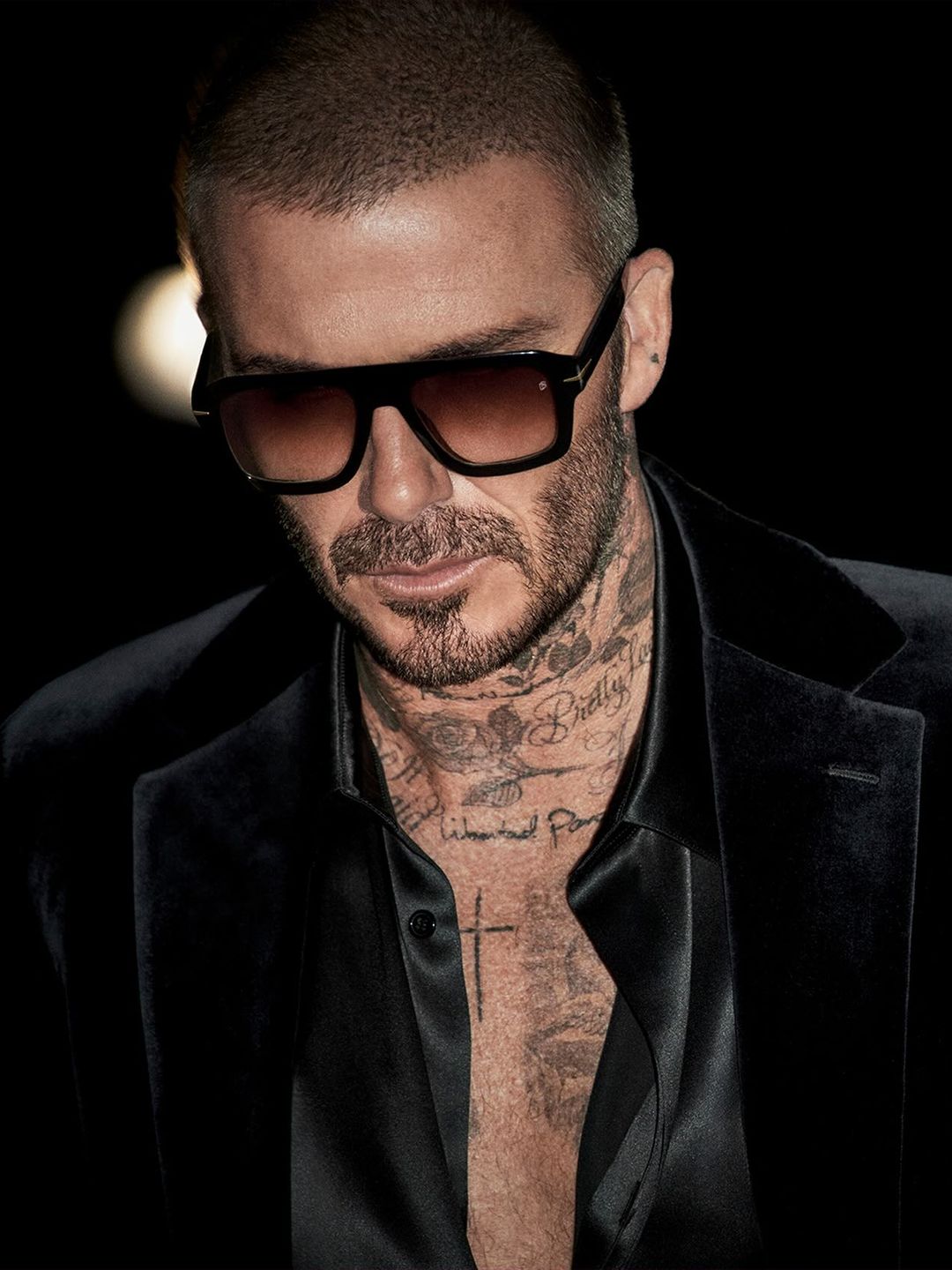 David Beckham poses for a photo in the DB 7127/S sunglasses style from the new collection