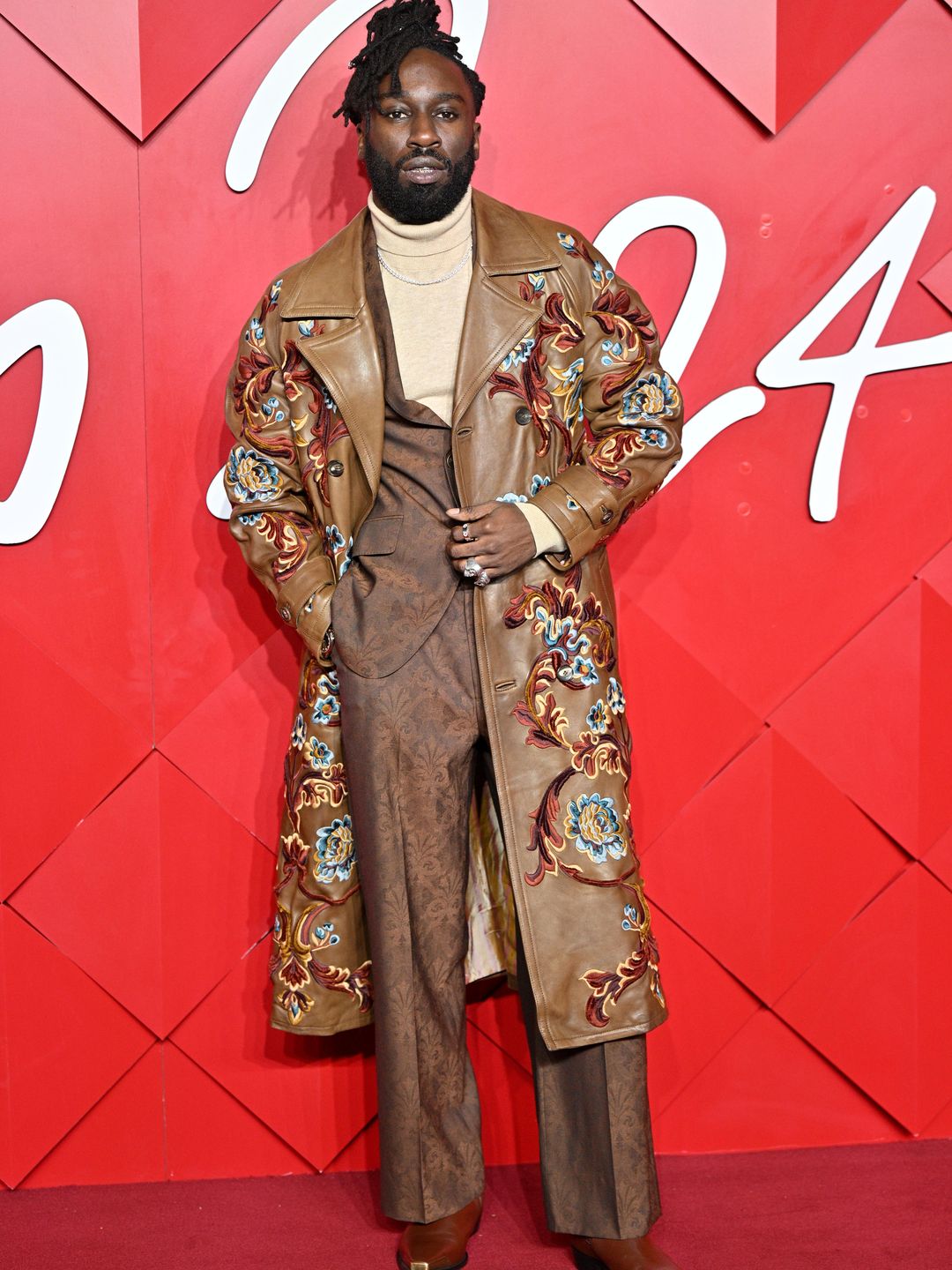 kojey radical in bronze suit