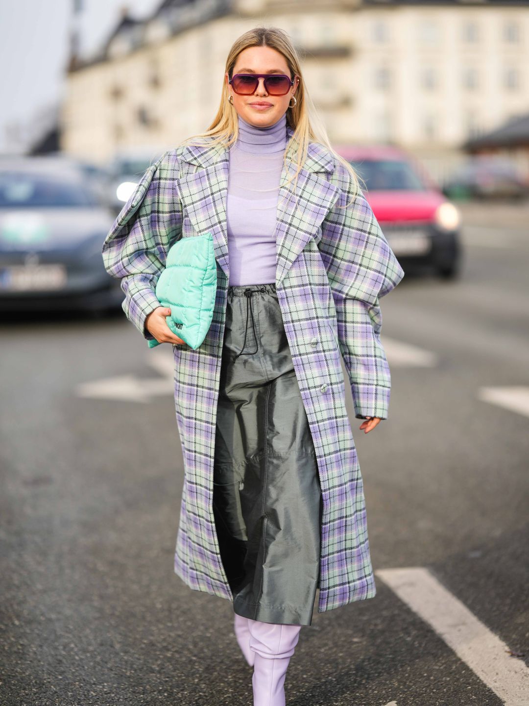 A stylish guest wearing a lilac turtleneck at Copenhagen Fashion Week AW23 