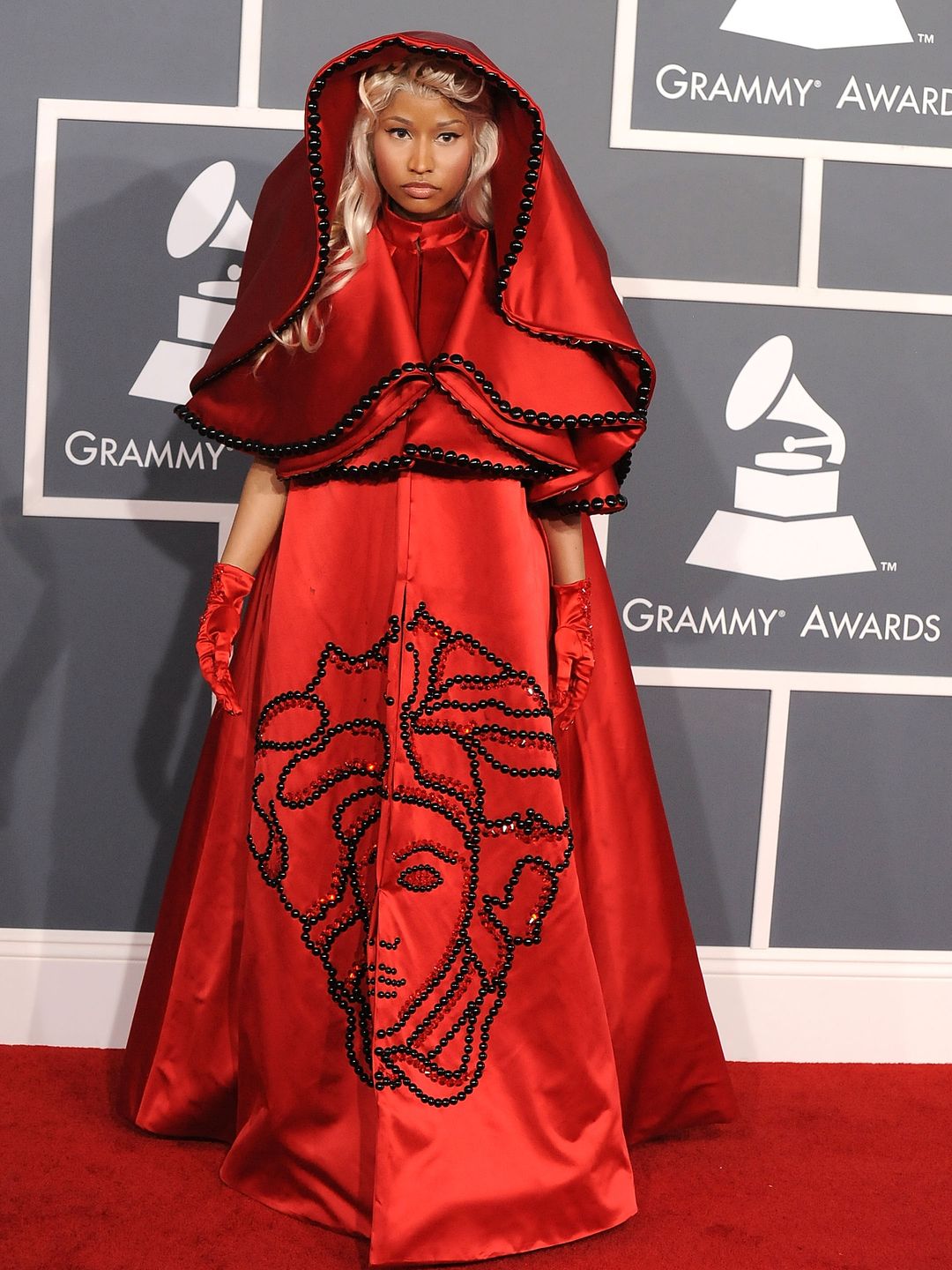 Nicki wore a red Versace cape dress emblazoned with the brand's signature Medusa head back in 2012.