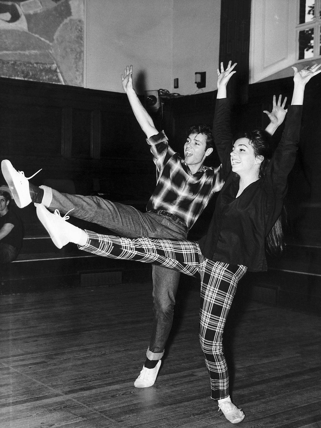 Liza Minnelli and Cliff Richard dancing together wearing checked ensembles, during their rehearsals for a London Television show, June 1964. 