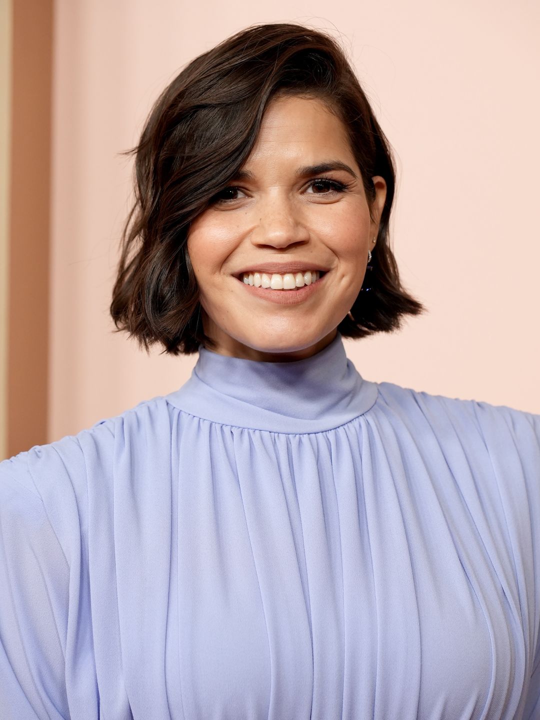 America Ferrera in a pale blue high-necked dress at the Oscars Luncheon
