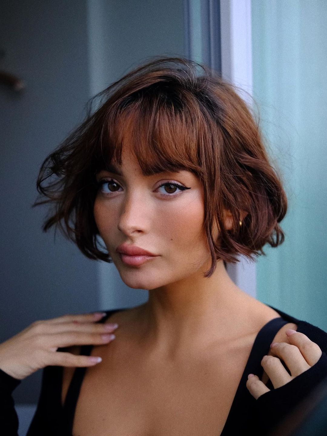 Girl sporting French bob and winged liner 