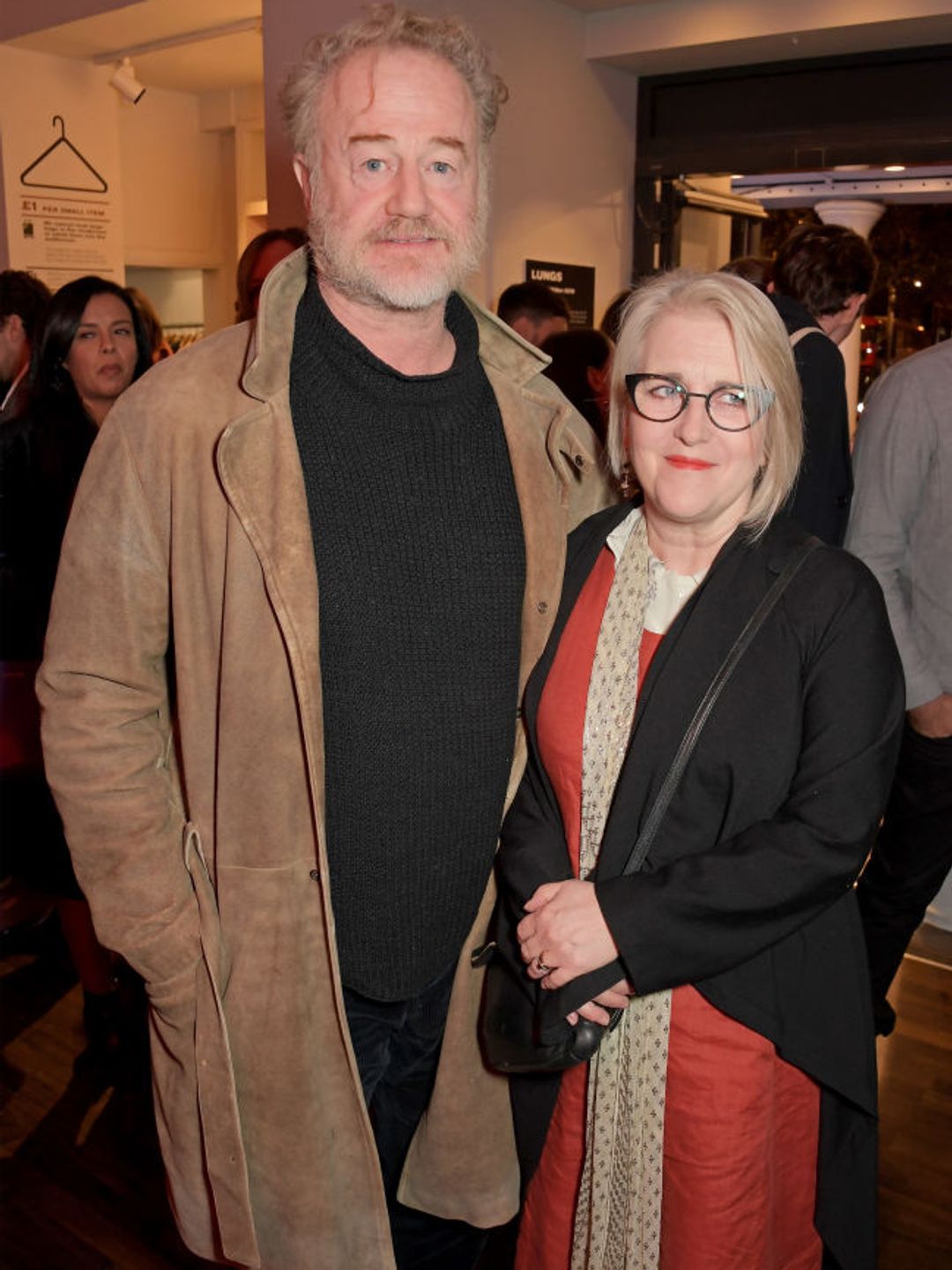 Owen Teale and wife Sylvestra pose together for a photo at a press night 