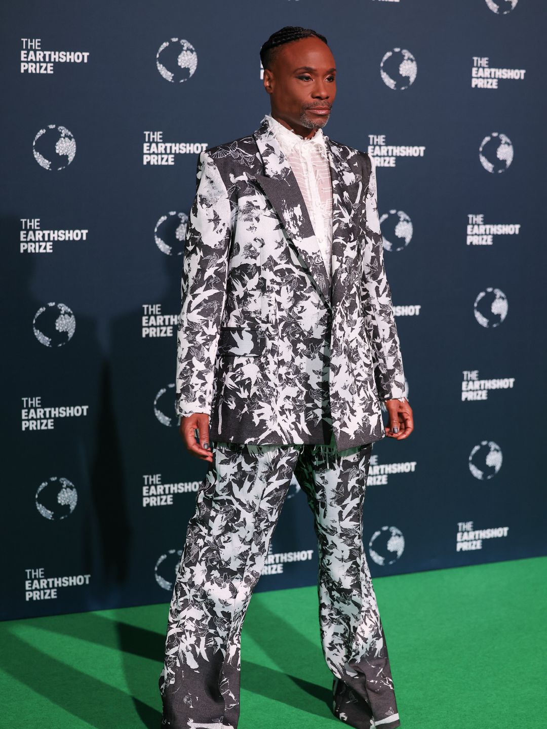 Billy Porter in a black and white suit