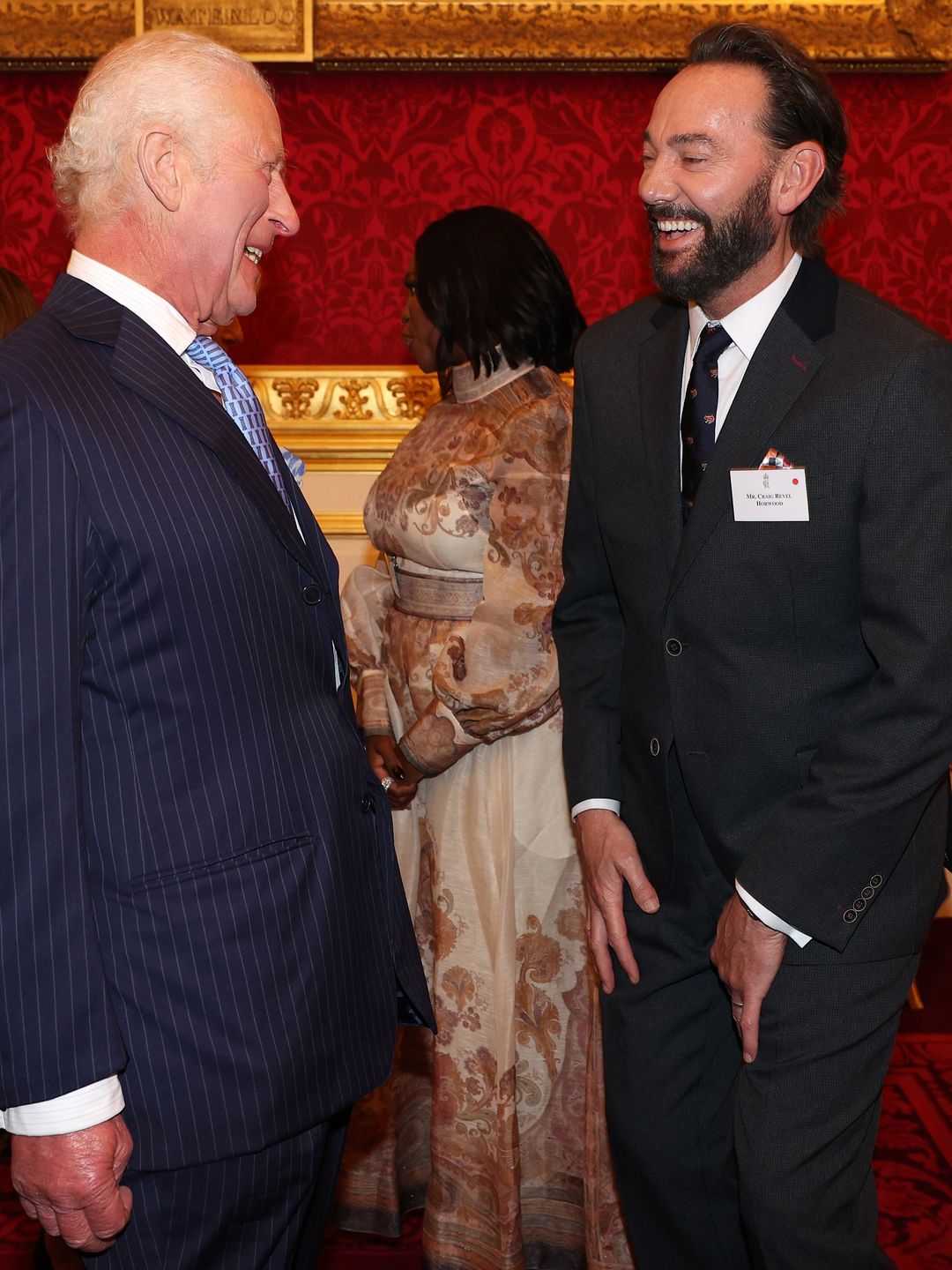 King Charles laughing with Craig Revel Horwood