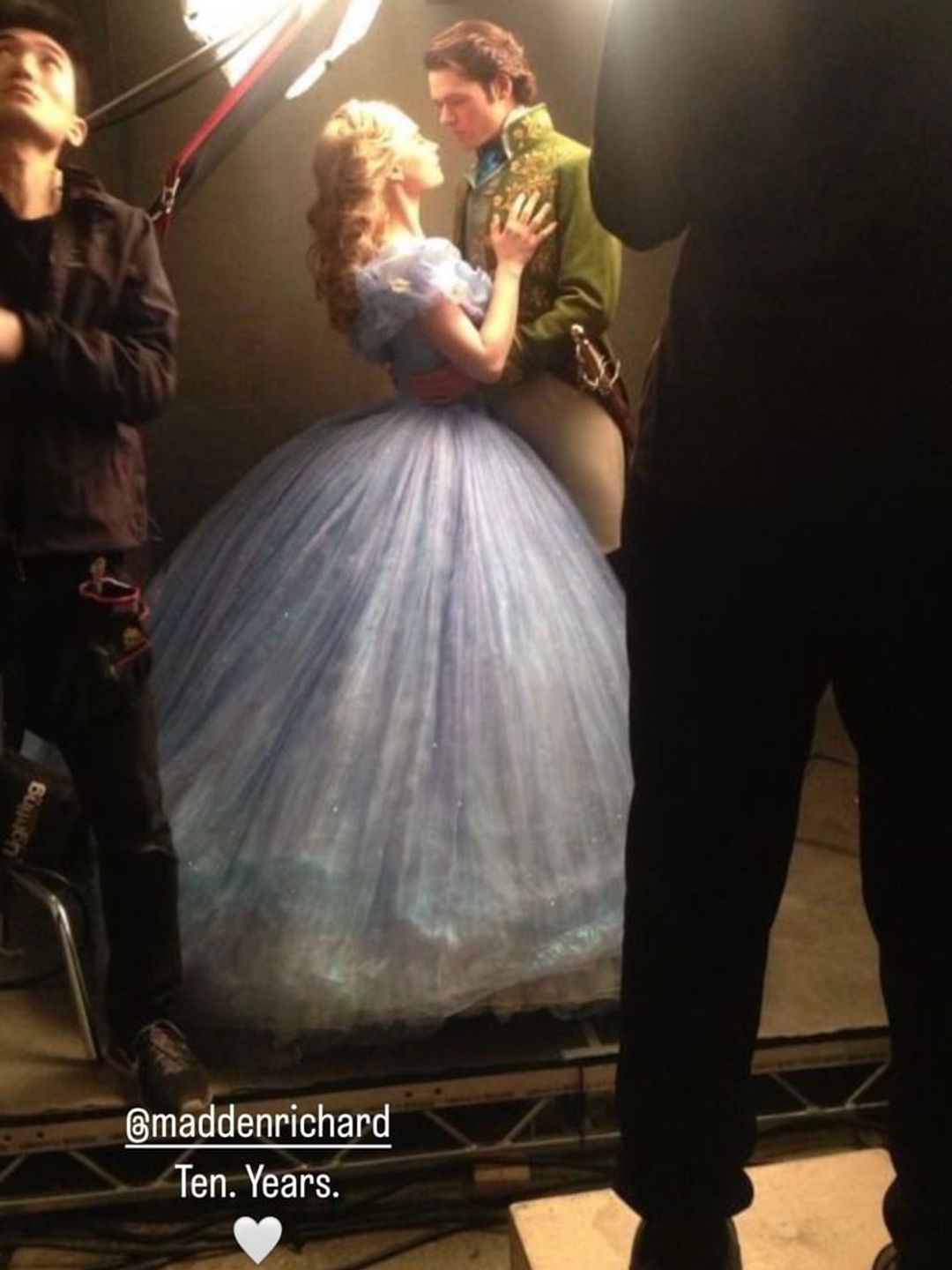 Lily James and Richard Madden as Cinderella and Prince Charming embracing 