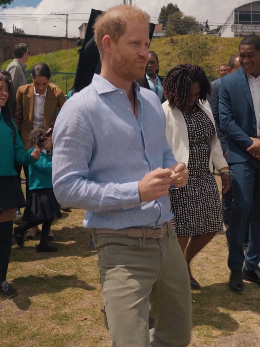 Prince Harry dancing with a group of students